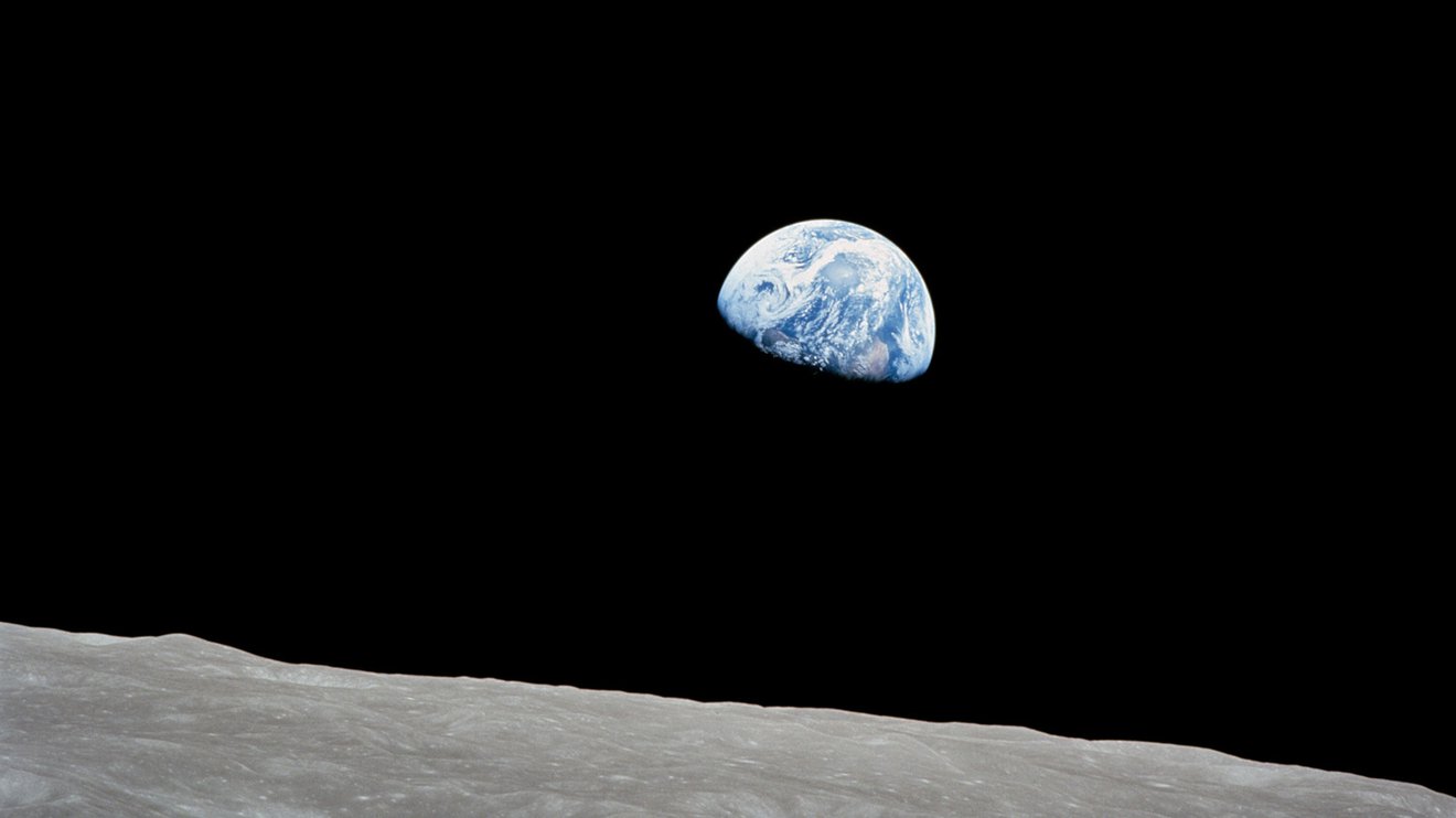 The Earth rises above the lunar horizon in this telephoto view taken from the Apollo 8 spacecraft. Season three of NASA's "On a Mission" podcast looks at Earth from all angles, including from the perspectives of the pioneering astronauts.