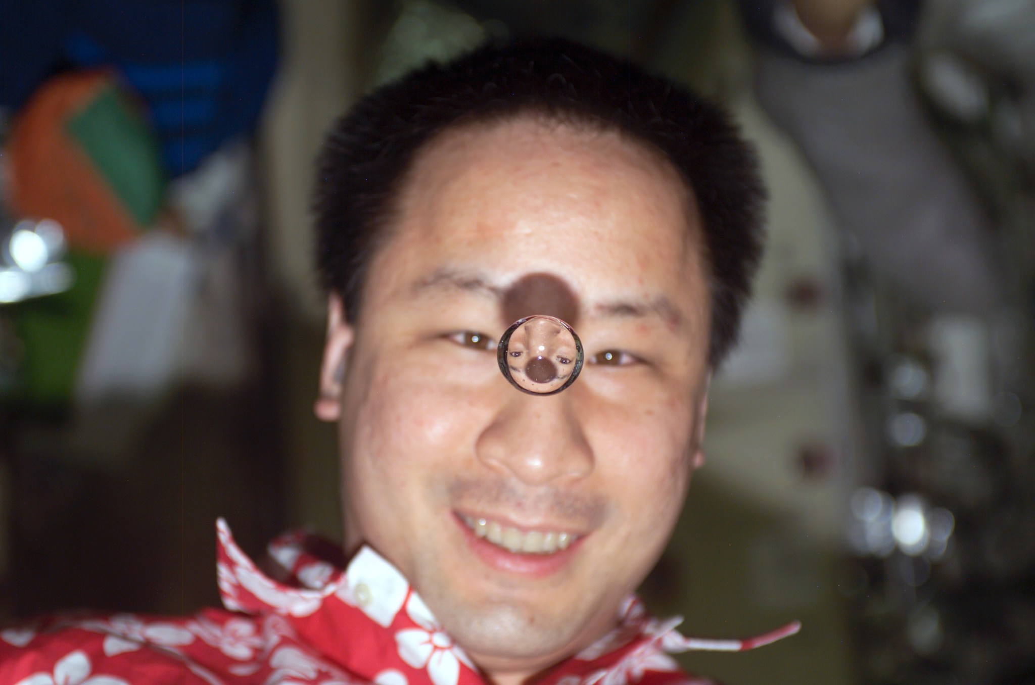 Astronaut with a bubble of water in front of his face.