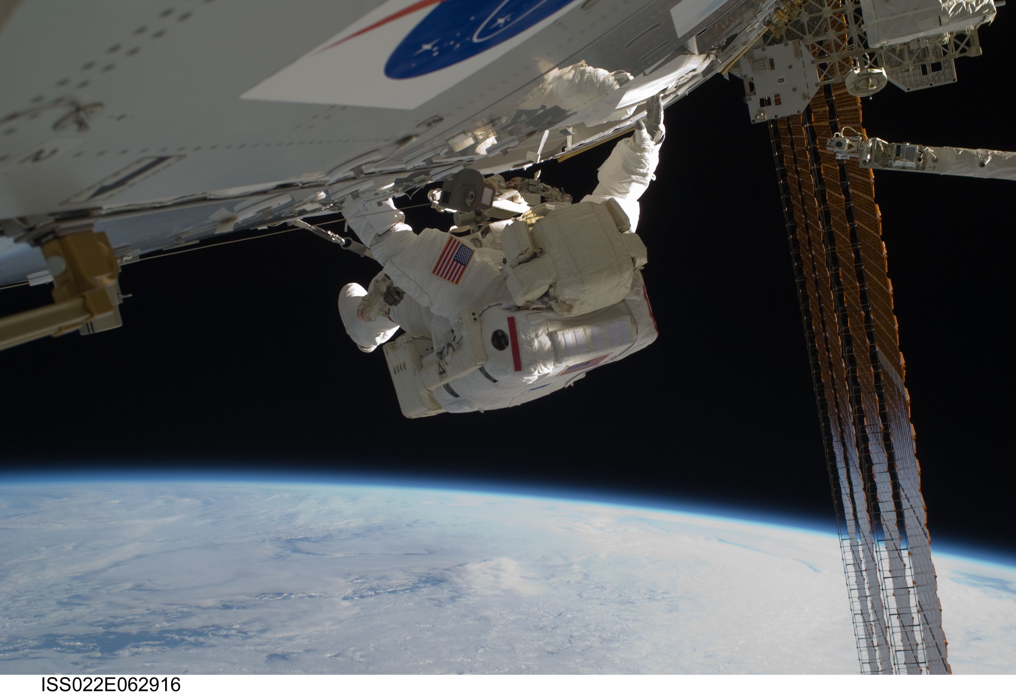 NASA astronaut Robert Behnken works on the International Space Station.