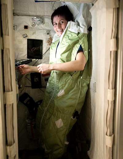 Astronaut in bed on ISS