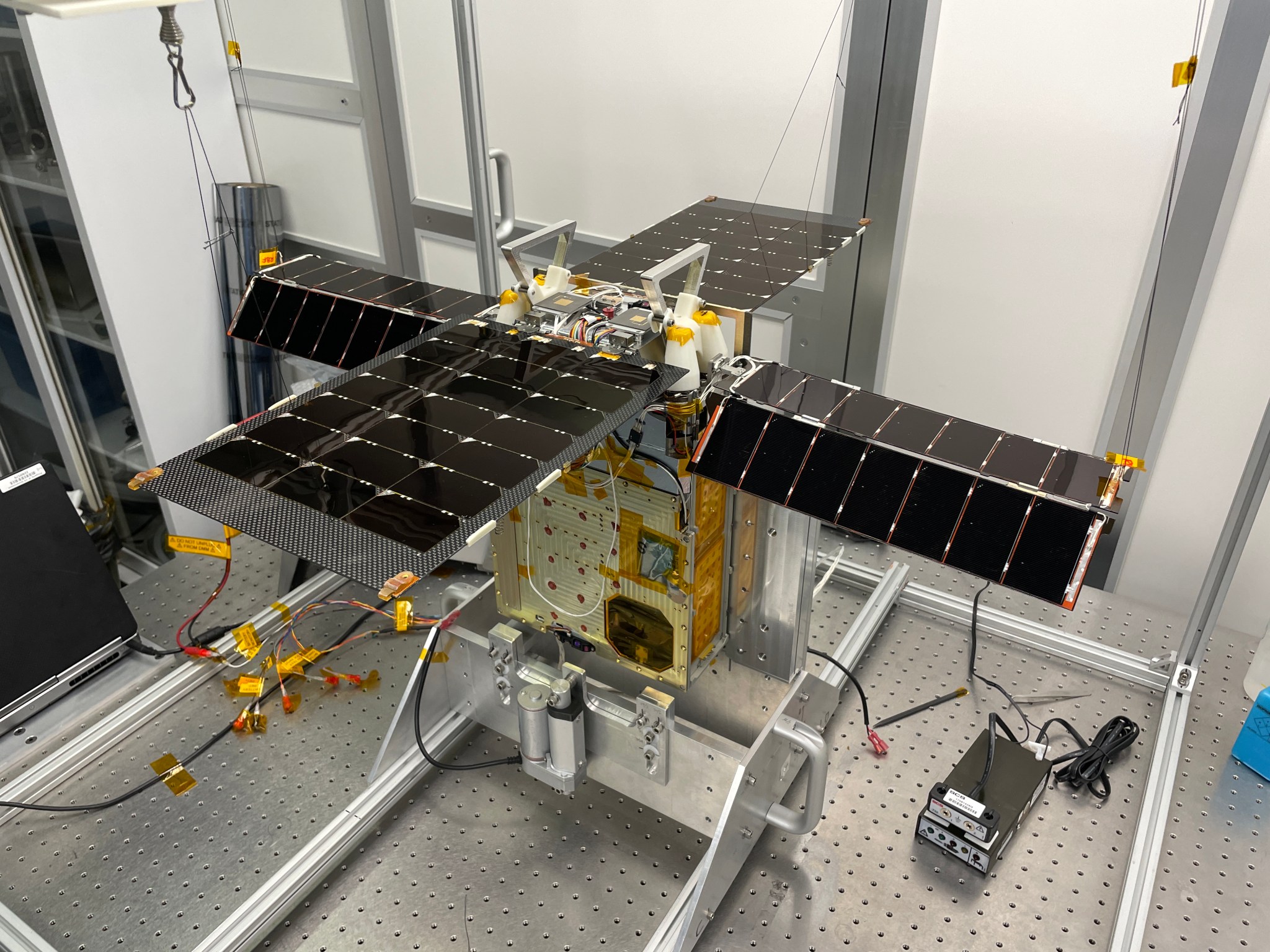 Earlier this year, NASA’s Lunar Flashlight mission underwent tests to prepare it for launch in November 2022. The solar-powered small satellite is shown here with its for solar arrays extended in a Georgia Tech clean room.