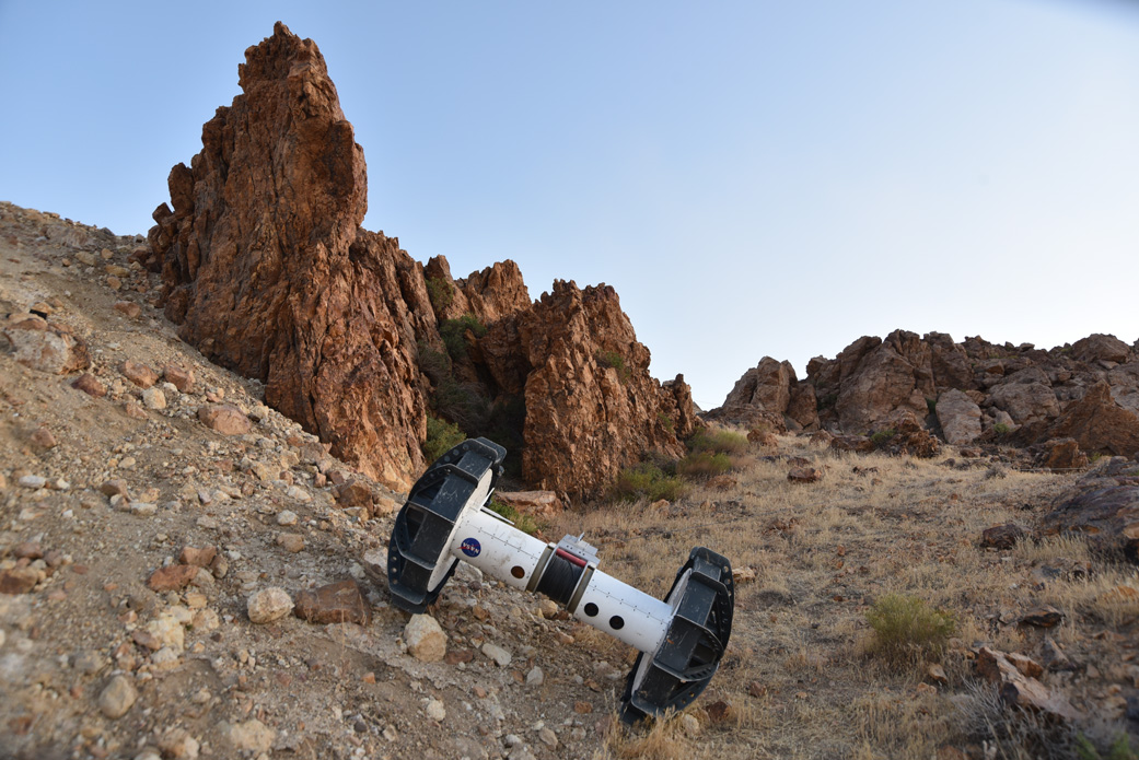 Two-wheeled Axel descending a canyon wall