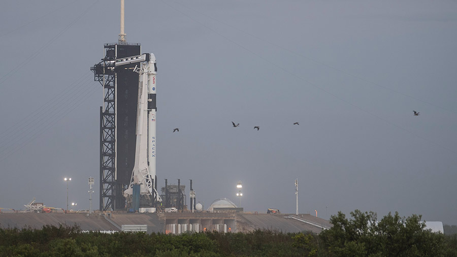 The SpaceX Falcon 9 rocket with the company's Crew Dragon spacecraft atop is seen at its launch pad at NASA's Kennedy Space Center in Florida.