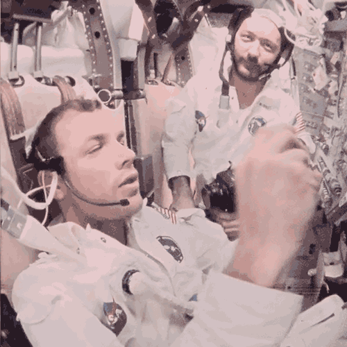 Astronauts in space eating.