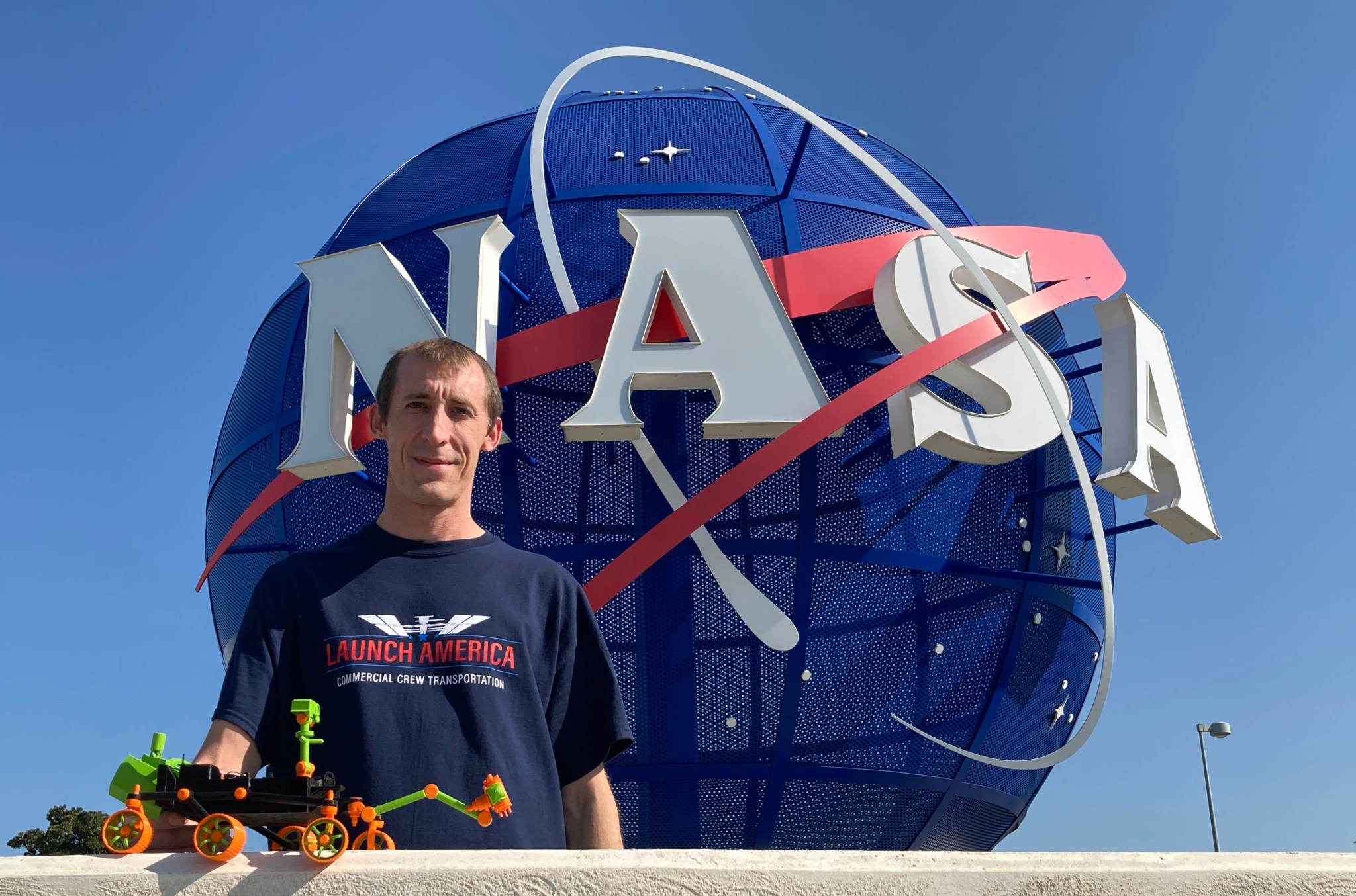 NASA intern David Tucker shows off his Mars Perseverance 3D print model at NASA Langley.