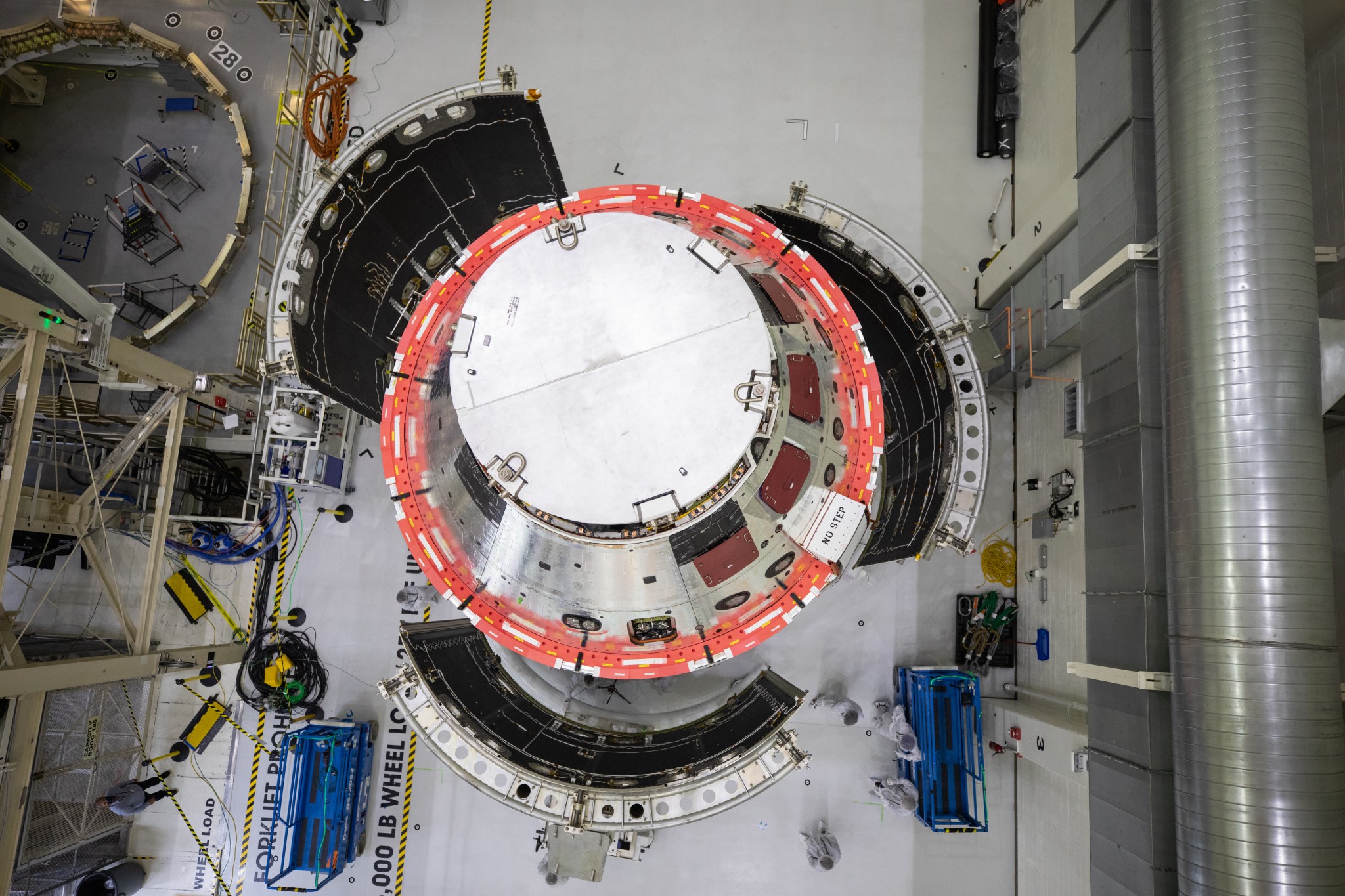 An overhead view of the three spacecraft adapter jettison fairing panels fitted onto Orion European Service Module on Oct. 13.