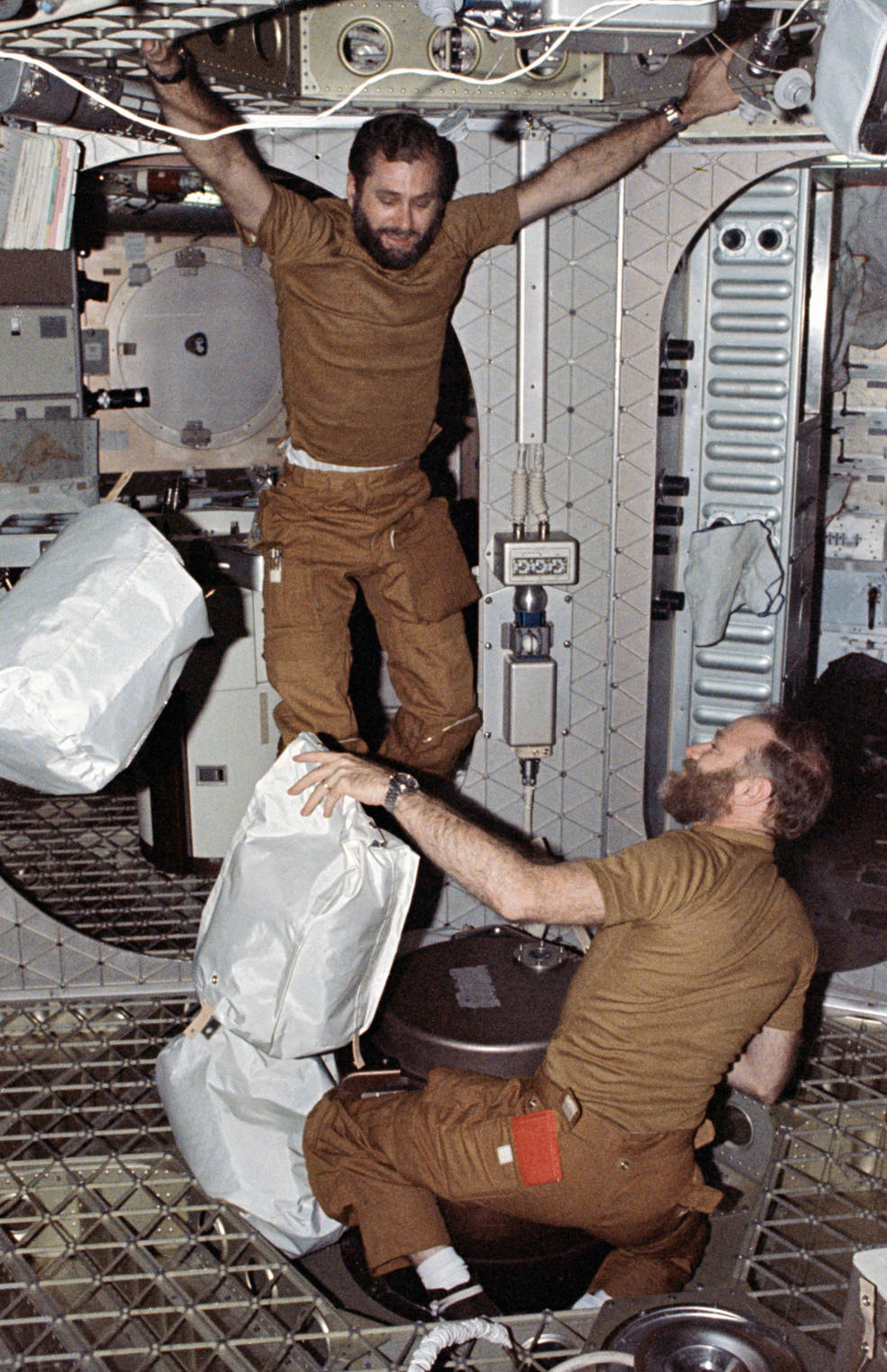 skylab_4_pogue_and_carr_compacting_trash_feb_1974