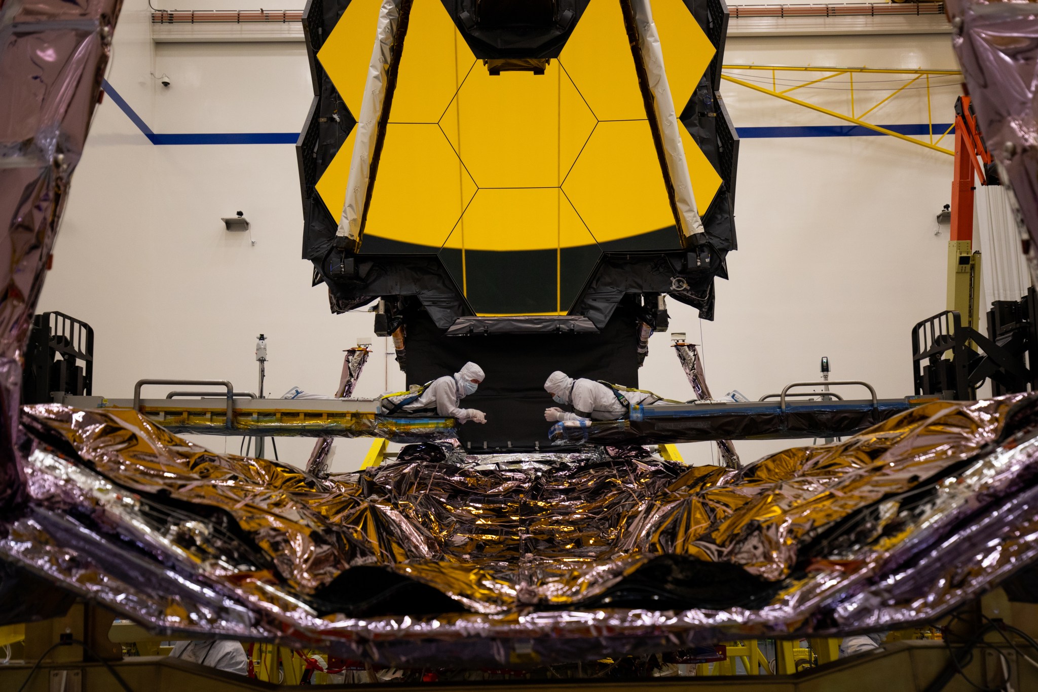 Technicians inspect a critical part of the James Webb Space Telescope known as the Deployable Tower Assembly.