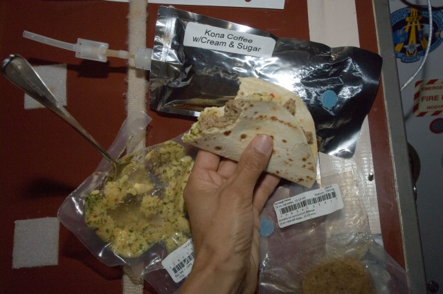closeup of food being eaten inside the space station
