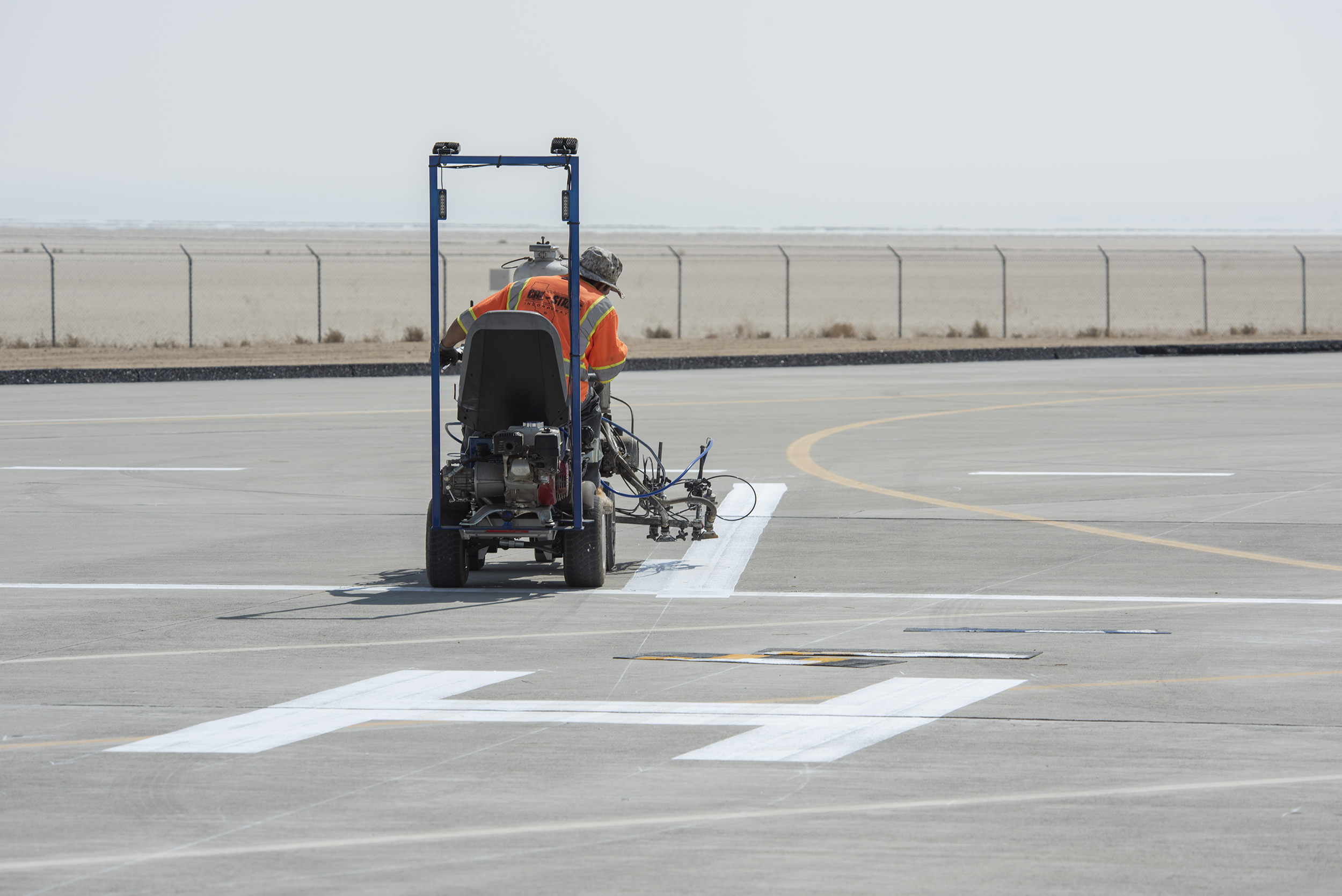 A worker painted vertiports and helipads at AFRC