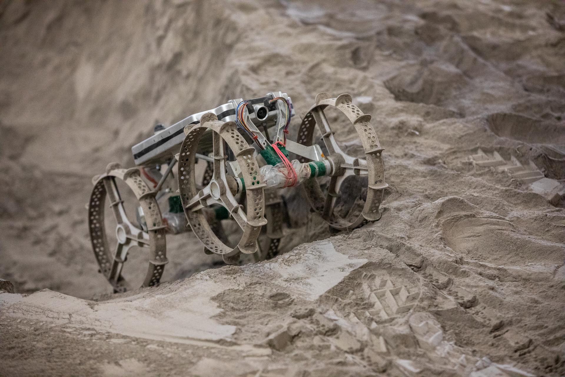 The Astrobotic CubeRover traverses the terrain in the regolith bin on Dec. 10, 2020, at NASA's Kennedy Space Center in Florida.