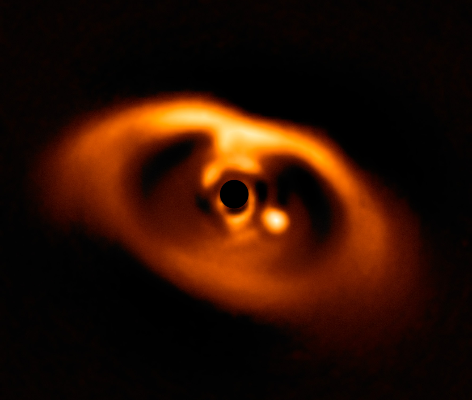 PDS 70 is approximately 370 light-years away and features a large gap in its inner ring.