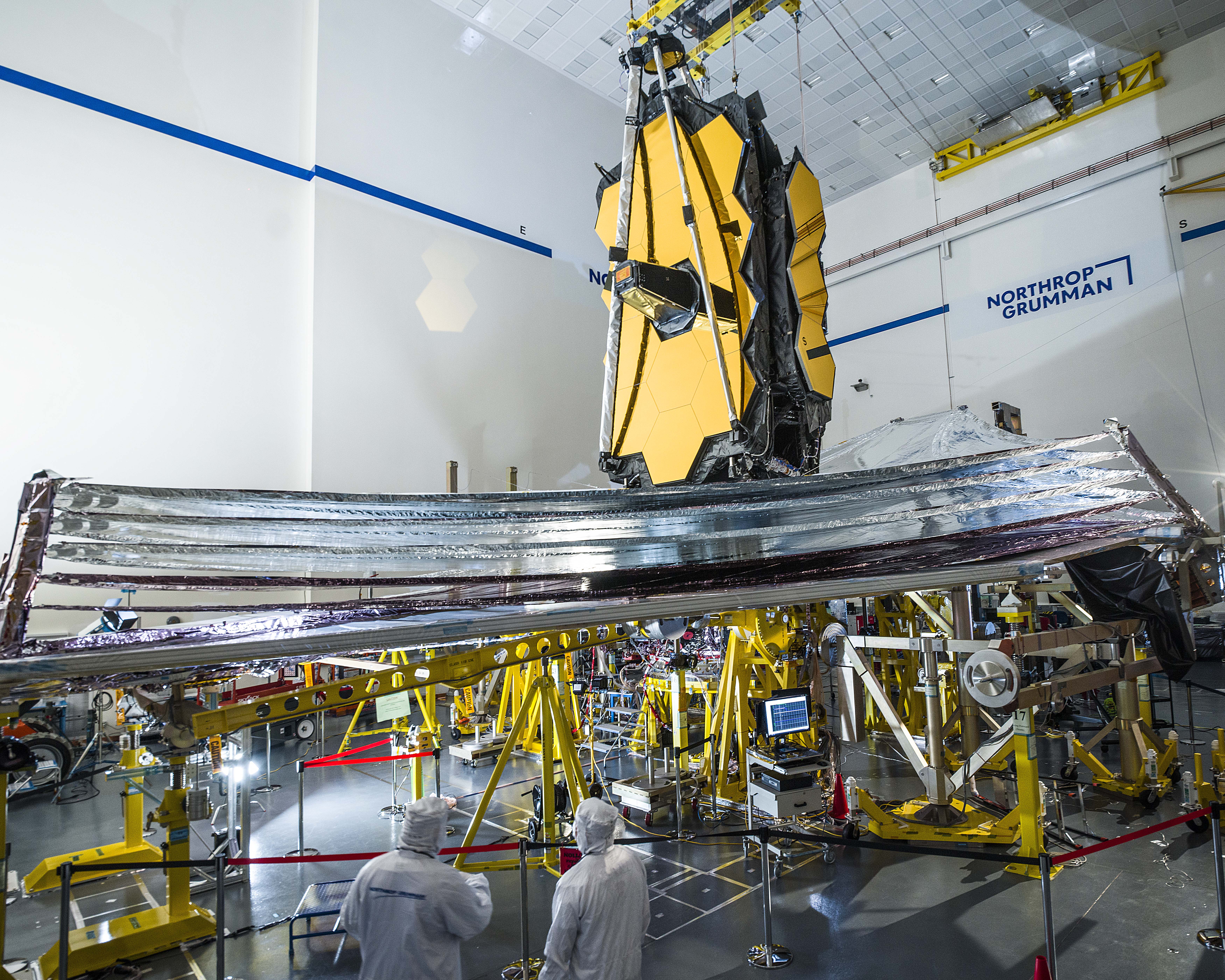 James Webb Space Telescope with people in foreground