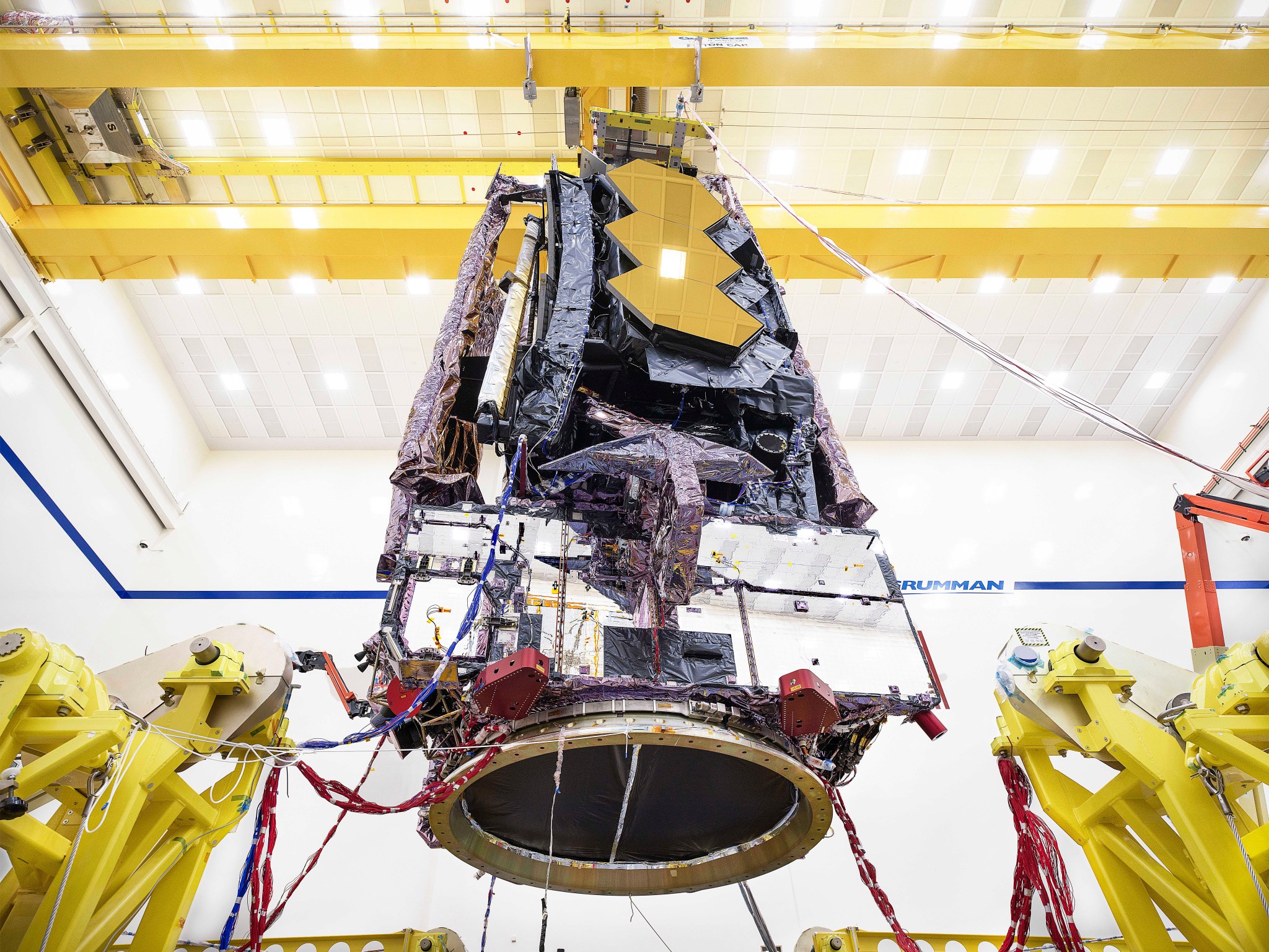 Technicians prepare the James Webb Space Telescope for transport to nearby testing facilities.