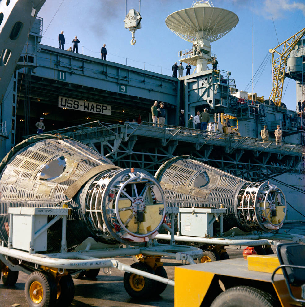 gemini_7_and_6_capsules_unloaded_from_uss_wasp_at_mayport_naval_station_jacksonville_dec_20_1965