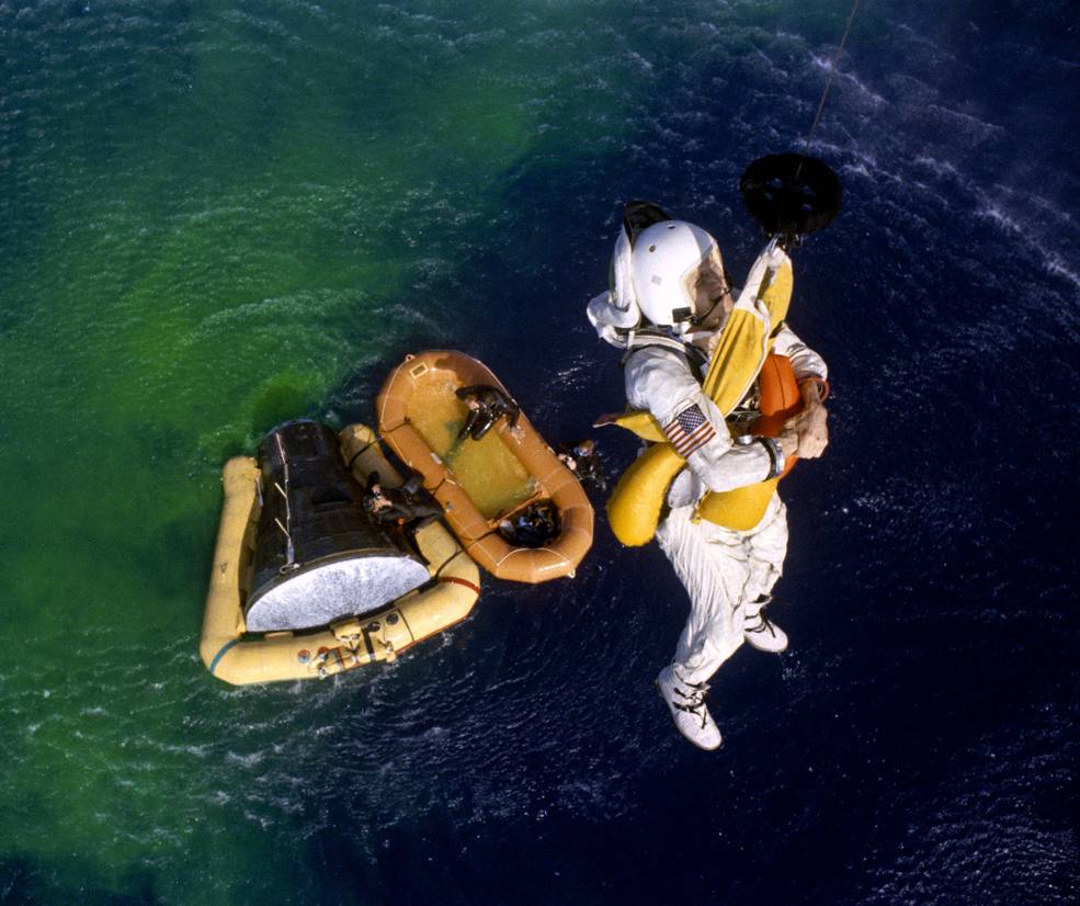 gemini_7_recovery_borman_being_hoisted_aboard_helicopter