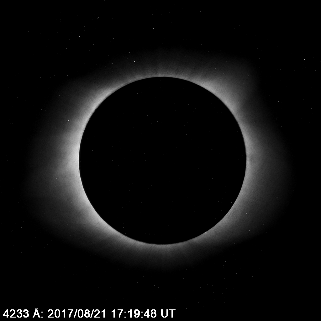 In each image, the corona appears as a fuzzy white ring around a black disk, set against a black background. It appears slightly different from image to image, sometimes dimmer and smaller, sometimes brighter and larger. White specks appear throughout one of the images. 