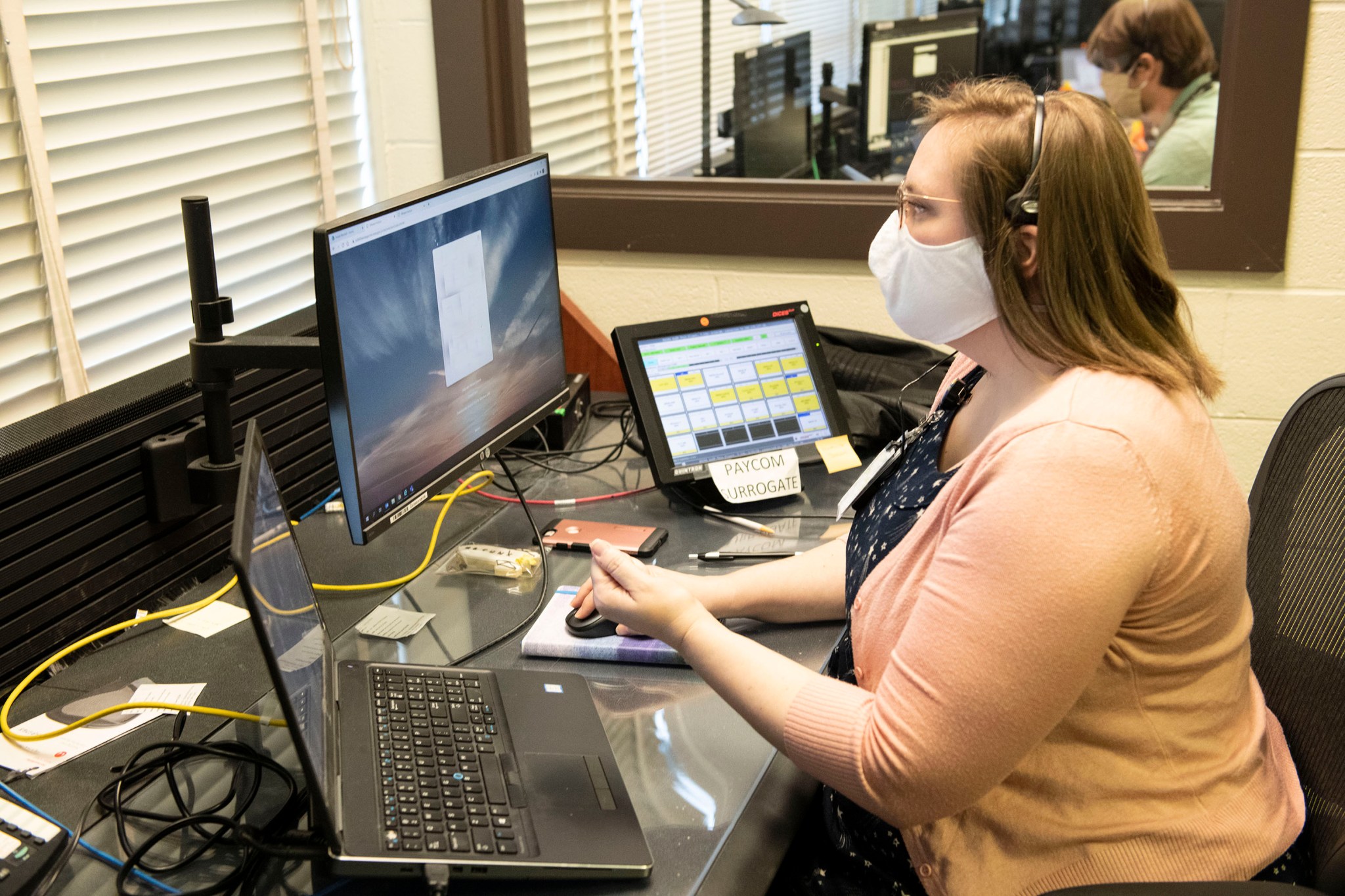 Crystal Klemmer, an Aerodyne Industries engineer at Marshall, monitors the Crew-1 launch from the mission control room.