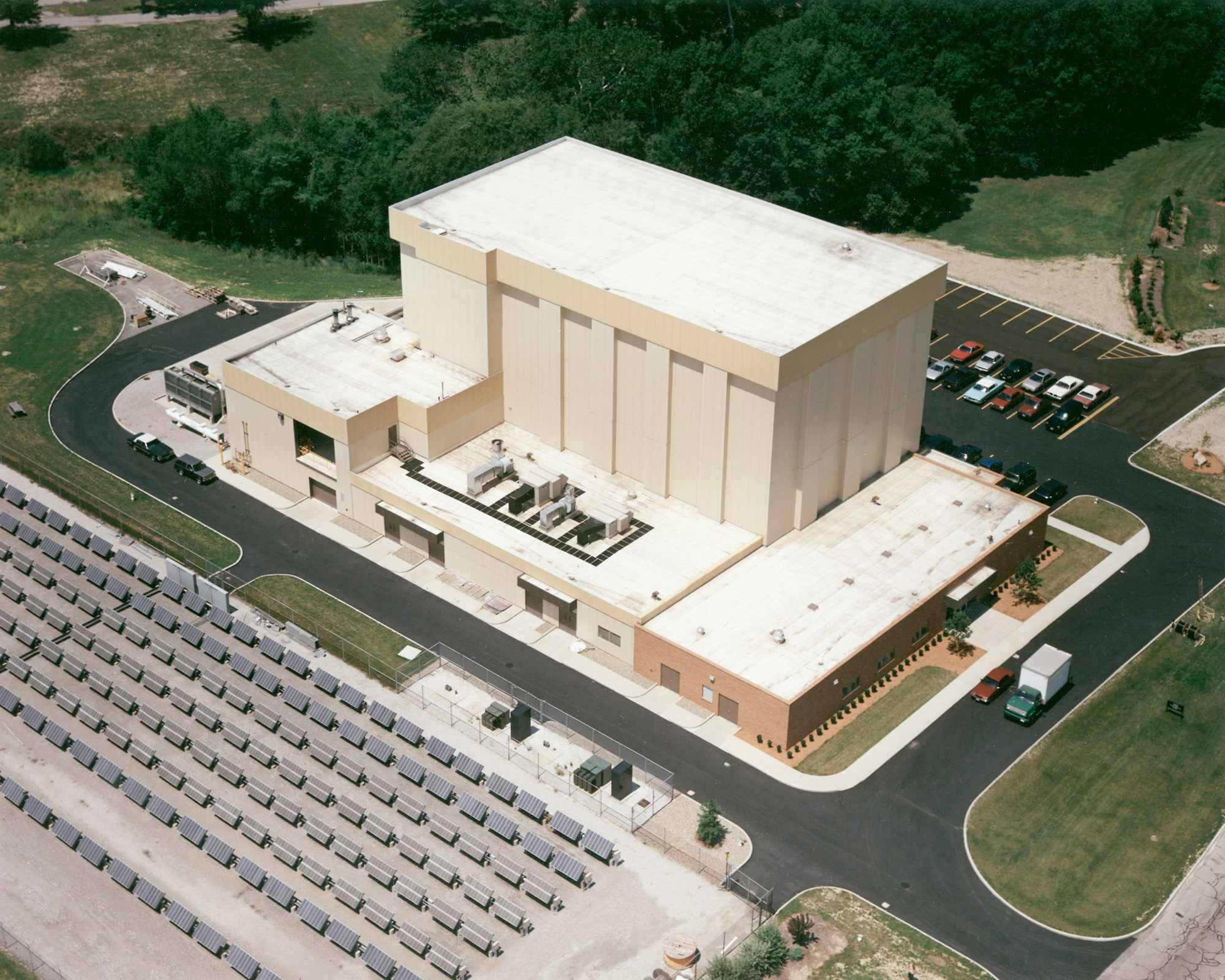 Illustration of aerial view of test facility, parking lot, and solar panels.