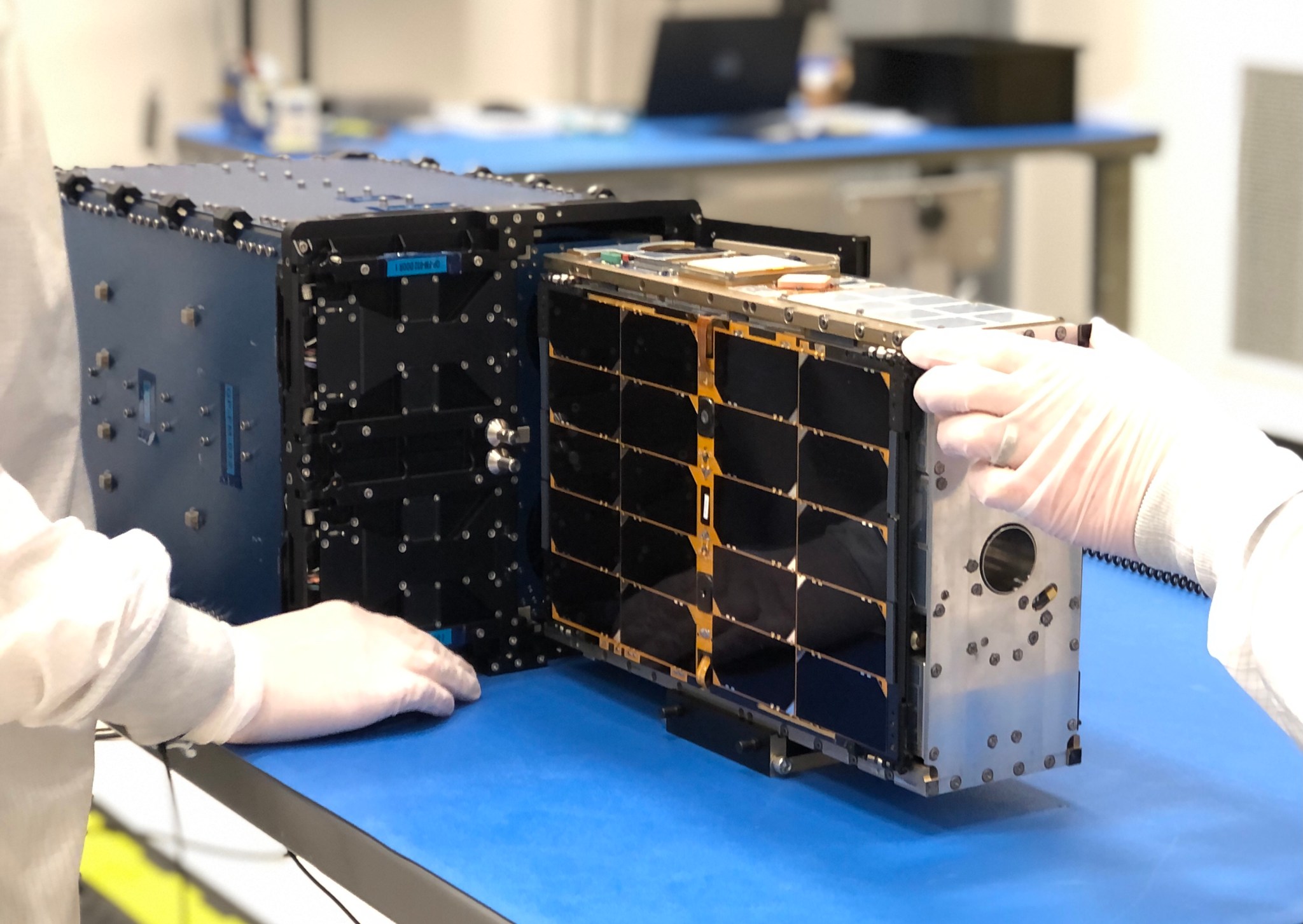 PTD-1 spacecraft being loaded in a CubeSat deployer before flight.