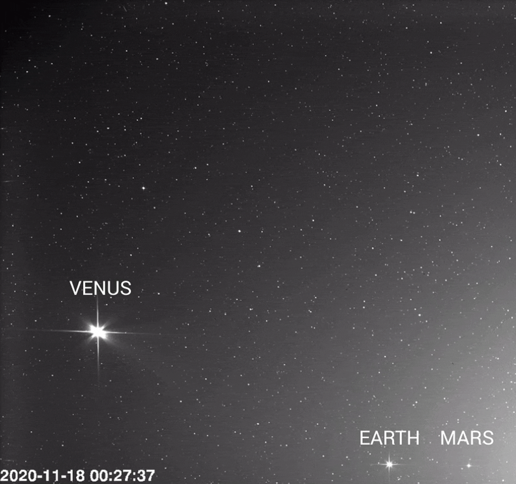 Series of images showing three bright planets -- Venus, Earth, and Mars -- against a background of stars.