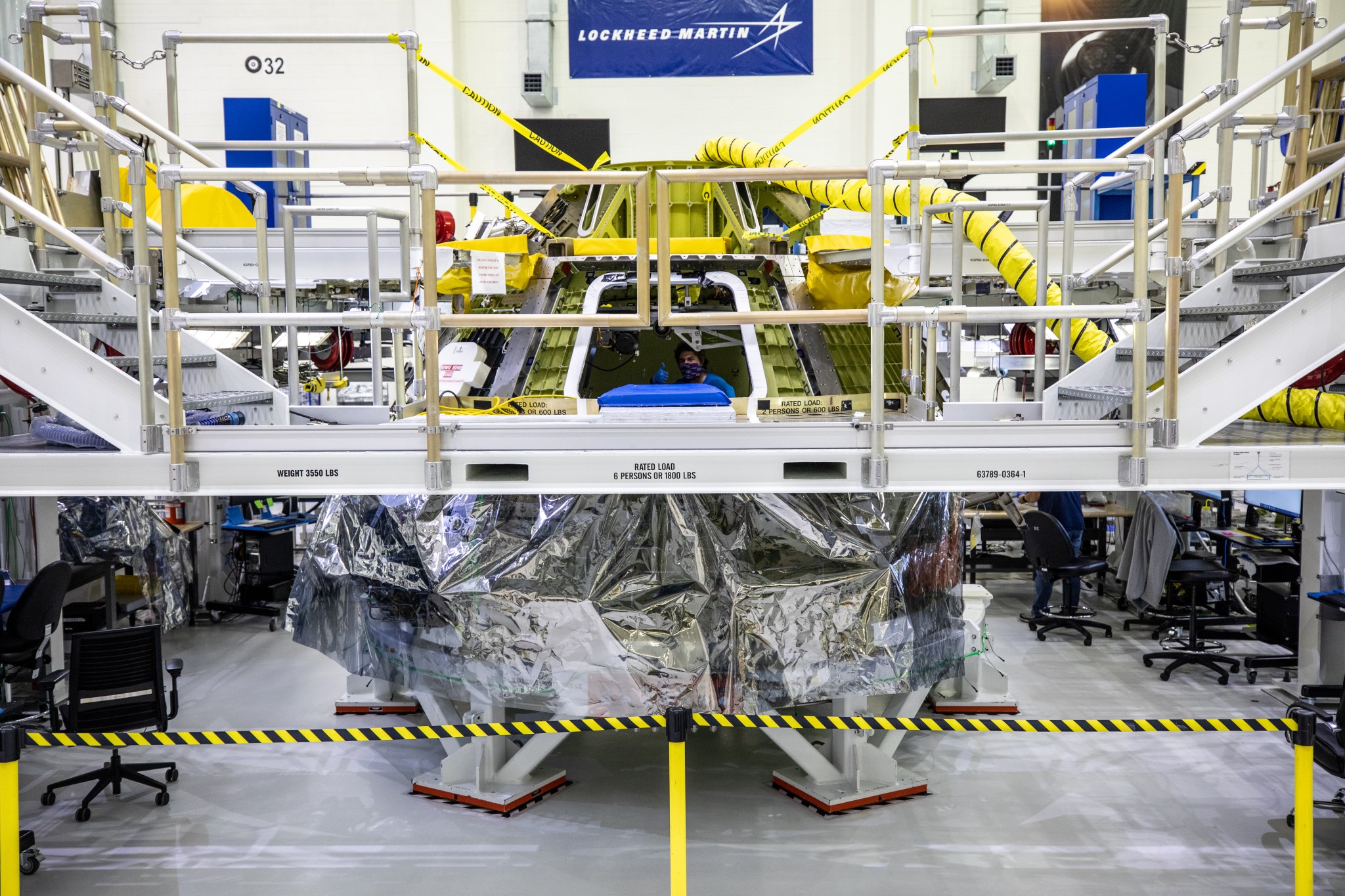 Technicians power on the Orion crew module for Artemis II for the first time May 27 at NASA’s Kennedy Space Center. 