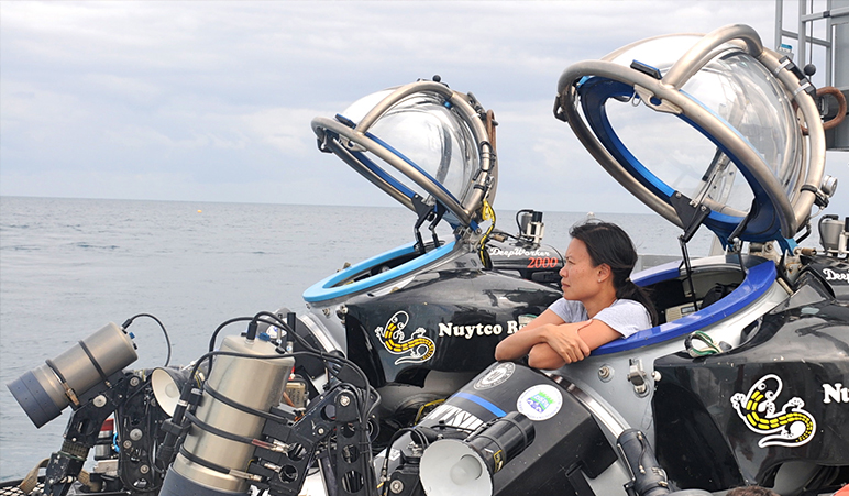 NASA astrobiologist Darlene Lim exits a submarine as part of project SUBSEA.