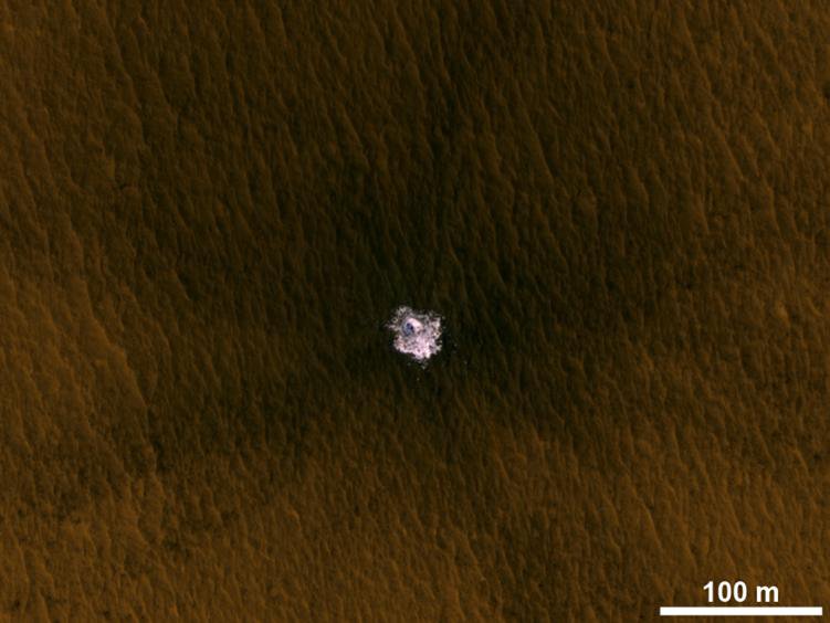 The image is an excerpt from an observation from NASA's Mars Reconnaissance Orbiter showing a meteorite impact
