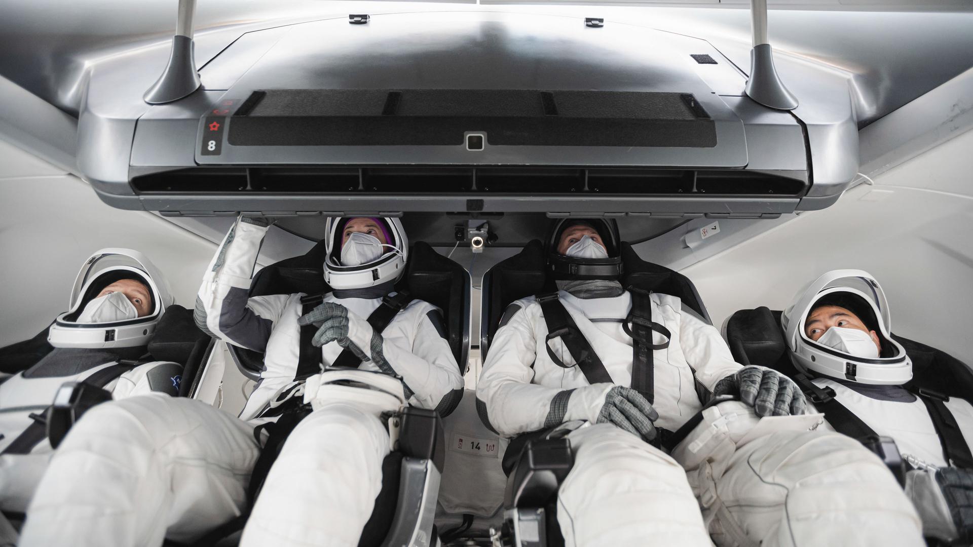 The crew for the second operational SpaceX Crew Dragon mission, SpaceX Crew-2, trains inside a mockup of the vehicle