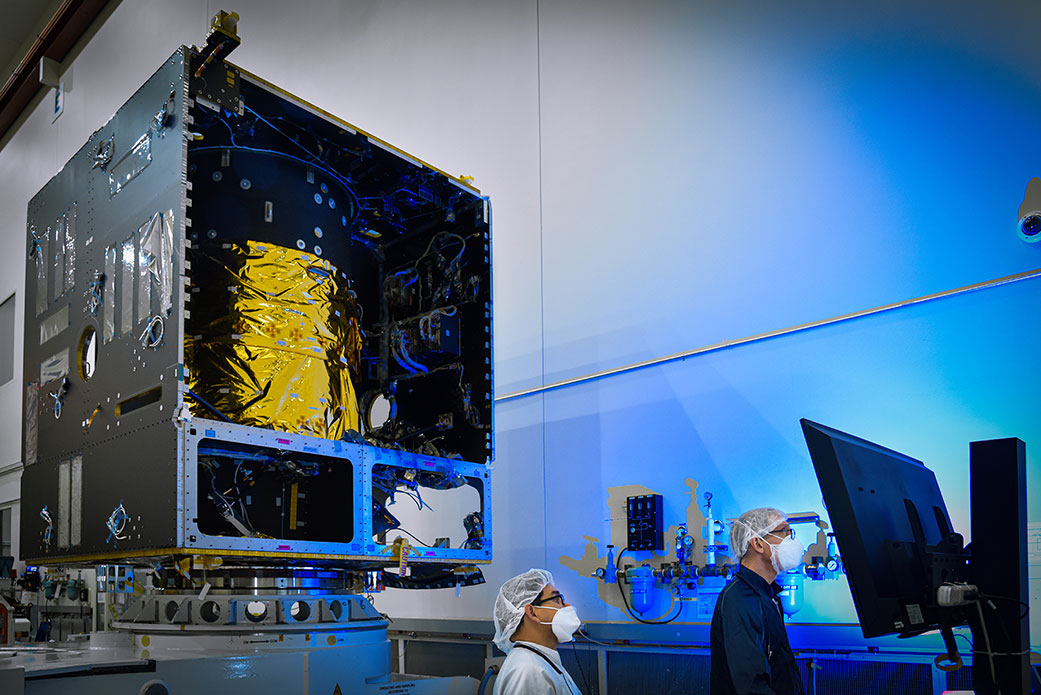 Technicians power on the main body of NASA’s Psyche spacecraft