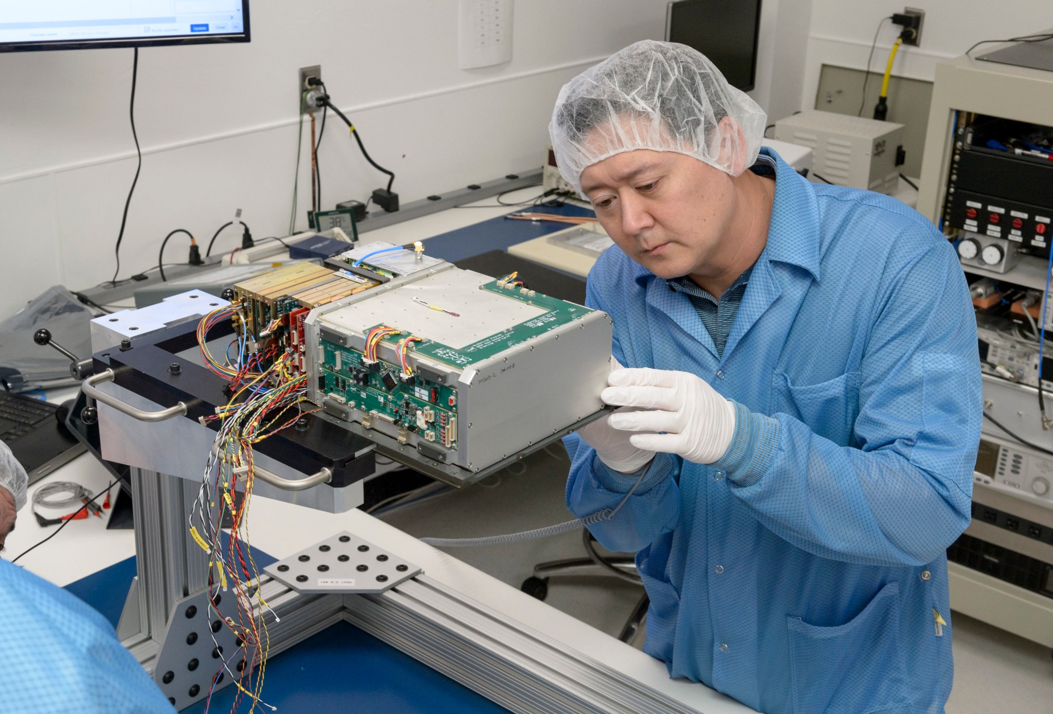 Integration and test engineer, Dan Rowan, works on internal components of BioSentinels CubeSat.