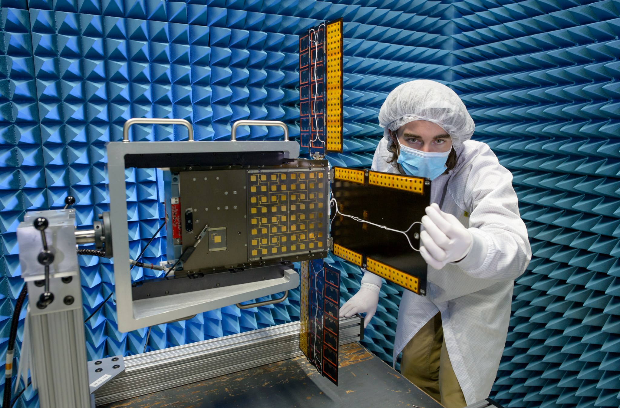 Quality assurance engineer Austin Bowie inspects BioSentinel’s solar array.