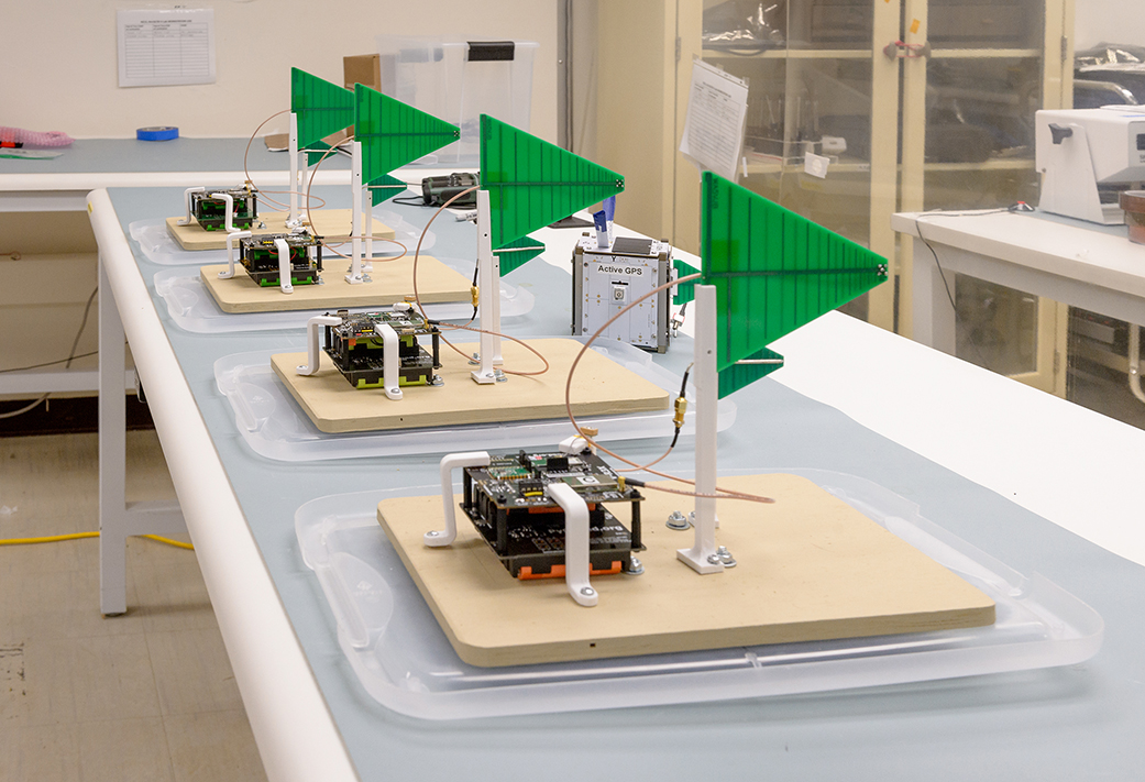 Four V-R3x ground units and a balloon flight unit are prepared for flight test in a lab at NASA Ames