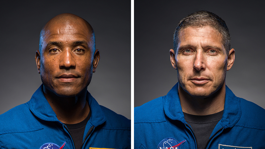 Spacewalkers Victor Glover (top) and Michael Hopkins are pictured working on upgrades to the Bartomoleo science platform attached to Europe's Columbus lab module. Credit: NASA TV