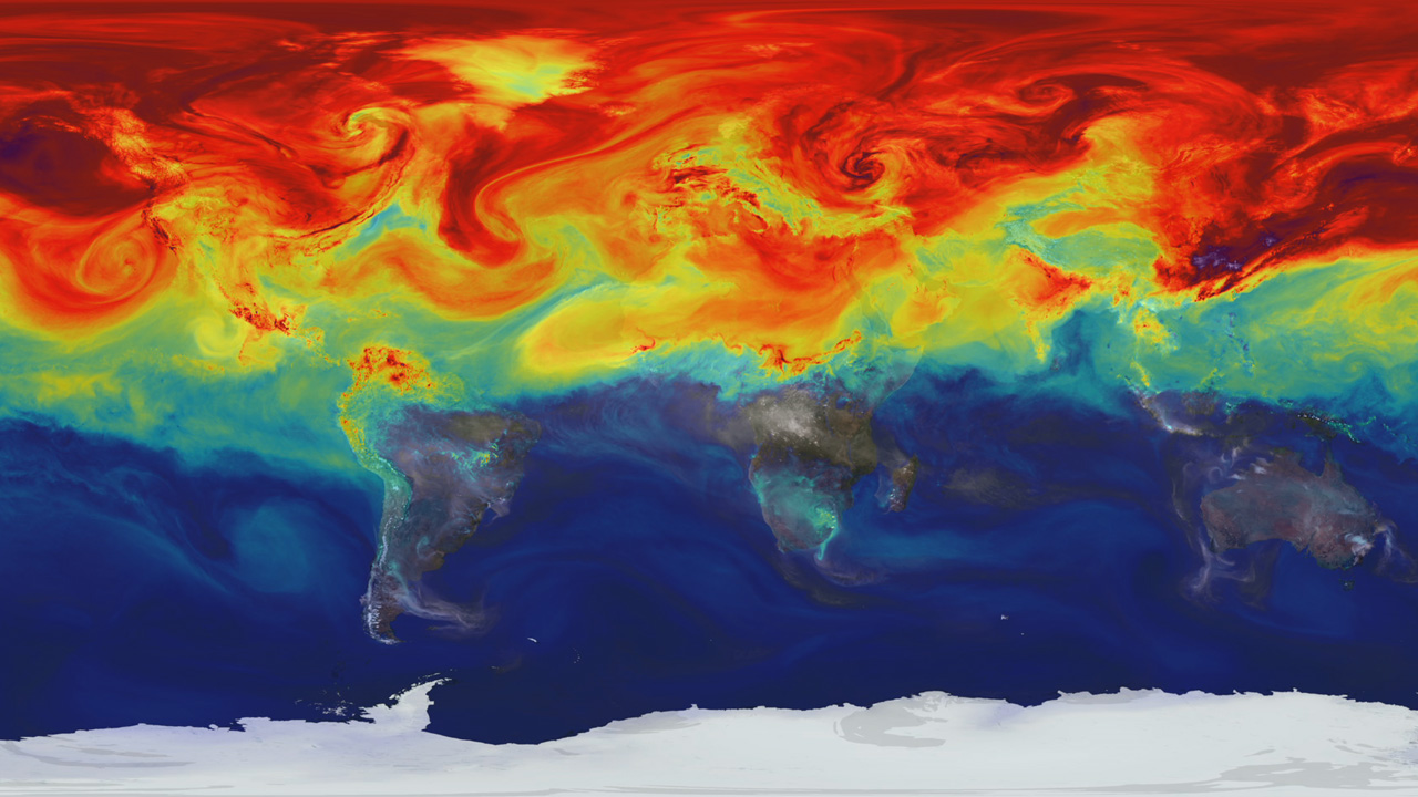 A data visualization showing how greenhouse gases like carbon dioxide fluctuate in Earth's atmosphere during the year. The visualization is a map of Earth's continents with Antarctica across the bottom. The top half of the map is covered by a rainbow of brightly colored swirls representing gases, with red, at the top, representing the highest concentrations, and green and blue, near the equator, representing lower concentrations. The Southern Hemisphere, or lower half of the map, is mostly uncovered by the colorful swirls.