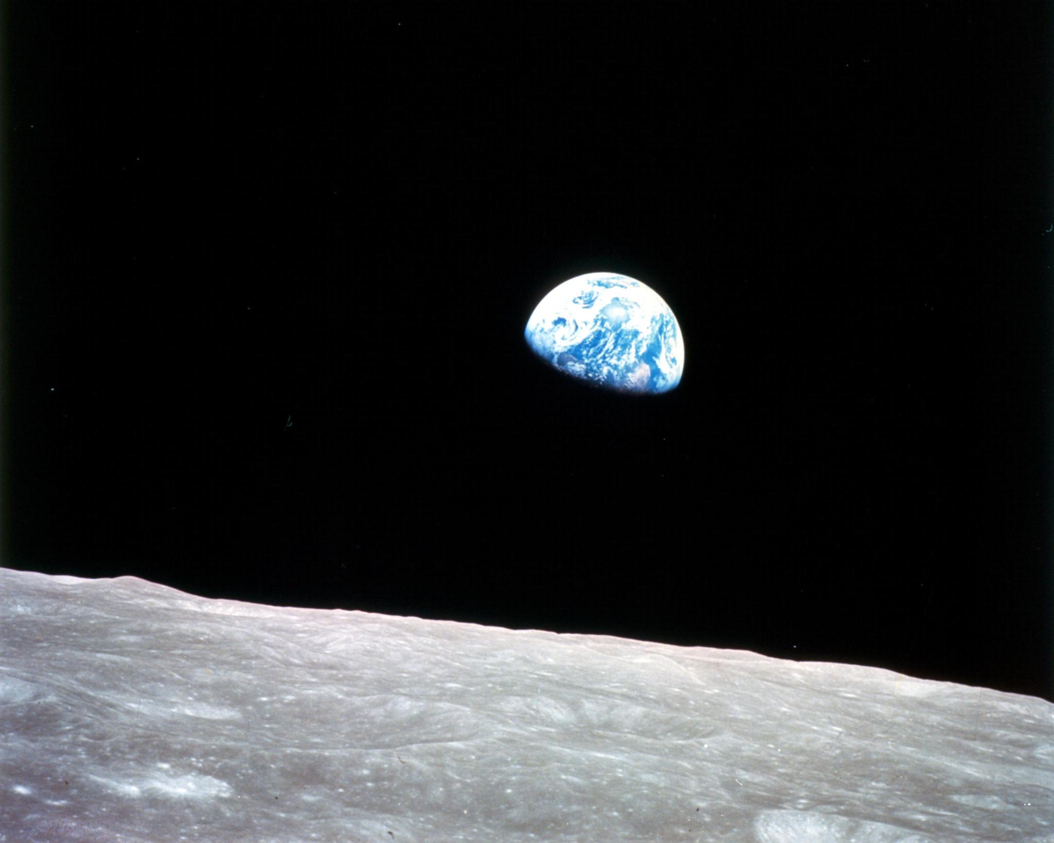 The Earth appearing over the horizon of the Moon.
