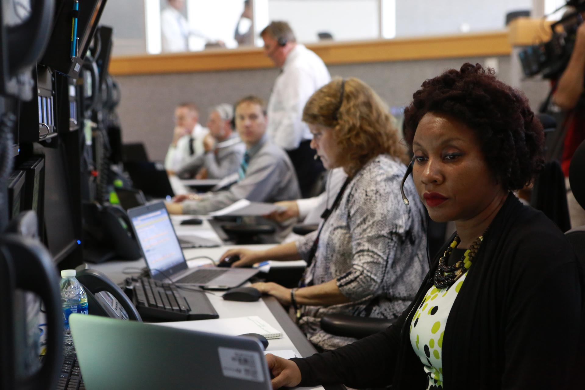 Space Launch System Test Conductors Roberta Wyrick, left, and Tracy Parks, monitor operations during a countdown simulation.