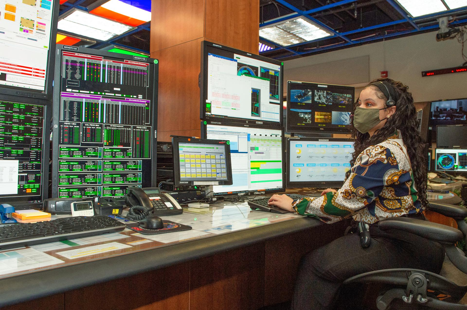Whitney Davis, a data manager coordinator in Marshall’s Payload Operations Integration Center, monitors science payloads.