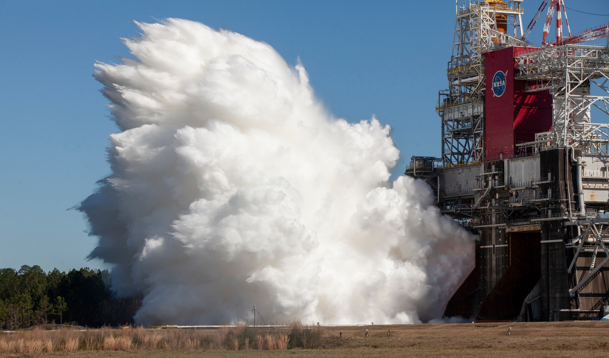 The core stage for the first flight of NASA’s Space Launch System rocket is seen in the B-2 Test Stand during a second hot fire 