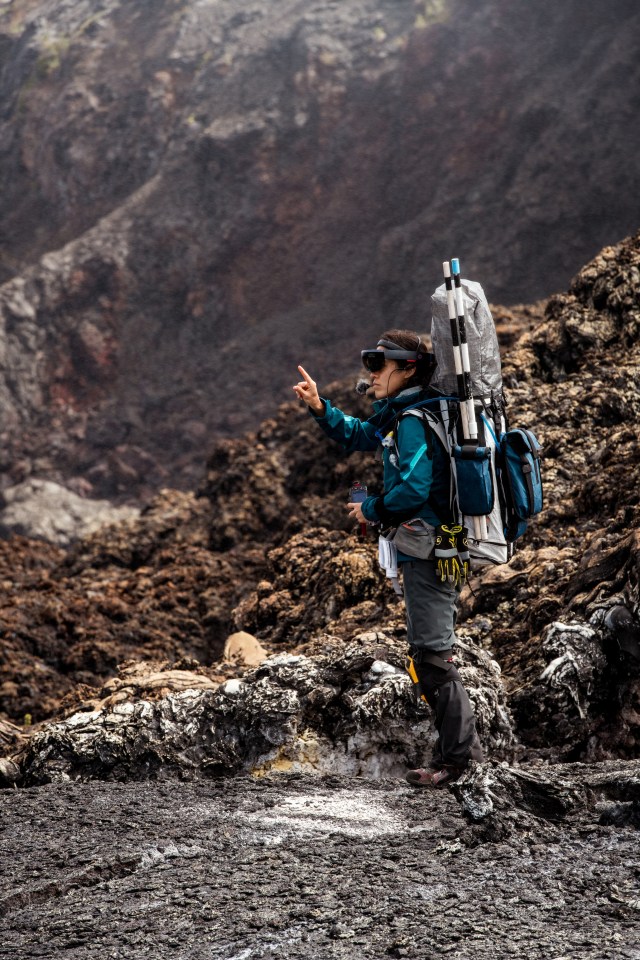 Kara Beaton uses a virtual reality headset while exploring a field site in Hawaii.