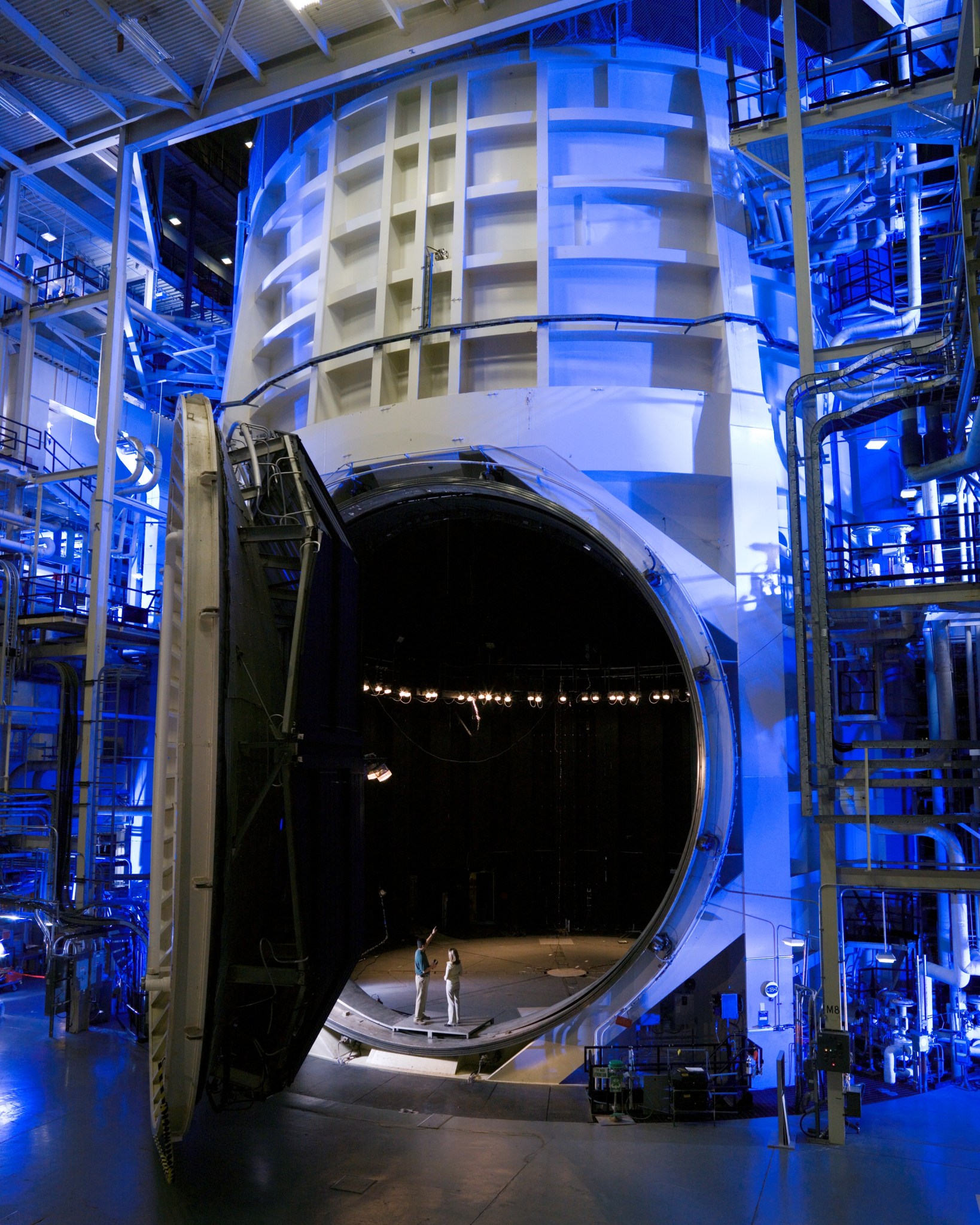 View of Johnson Space Center's Thermal Vacuum Chamber A with its gigantic door open.