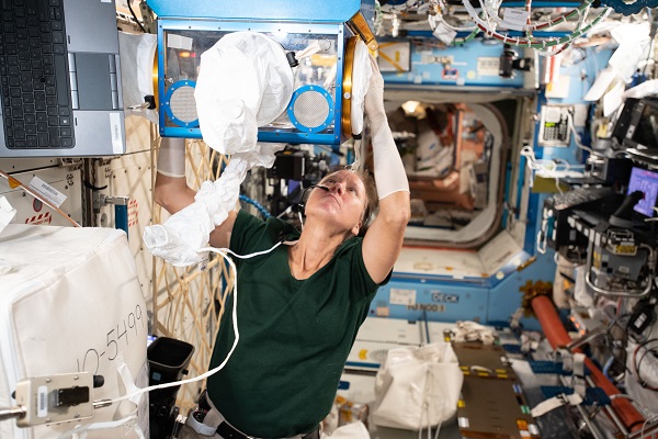 image of astronaut working on experiment