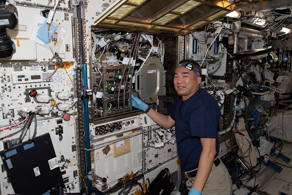 image of astronaut working on experiment