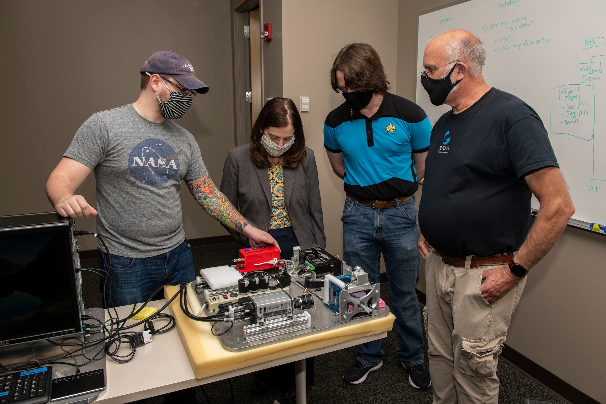 The Ring-Sheared Drop flight team practices in-flight procedures with experimental hardware at Marshall. 