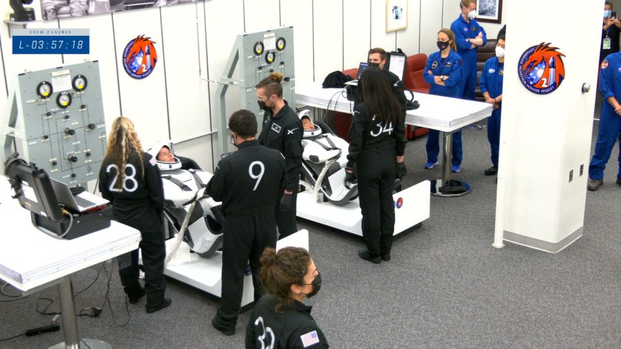 Crew-2 astronauts suit up in their SpaceX spacesuits in the Neil Armstrong Operations and Checkout Building at NASA's Kennedy Space Center in Florida on April 23, 2021.