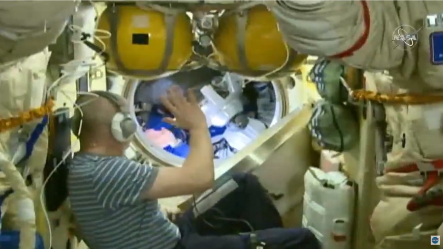 The hatch closing between the Soyuz MS-17 and station in preparation for the undocking of Expedition 64 crew. Credit: NASA TV