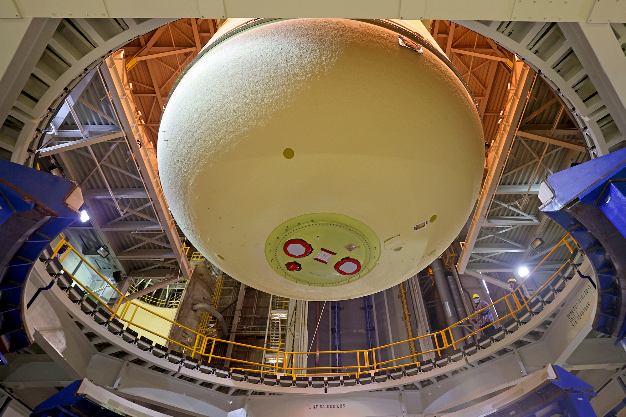 This image highlights the liquid oxygen tank, which will be used on the core stage of NASA’ Space Launch System rocket for Artemis II, the first crewed mission of NASA’s Artemis program, at NASA’s Michoud Assembly Facility. The SLS core stage is made up of five unique elements: the forward skirt, liquid oxygen tank, intertank, liquid hydrogen tank, and the engine section. The forward skirt houses flight computers, cameras, and avionics systems. The liquid oxygen tank holds 196,000 gallons of liquid oxygen cooled to minus 297 degrees Fahrenheit. The LOX hardware sits between the core stage’s forward skirt and the intertank. Along with the liquid hydrogen tank, it will provide fuel to the four RS-25 engines at the bottom of the core stage to produce more than two million pounds of thrust to launch NASA’s Artemis missions to the Moon. Together with its four RS-25 engines, the rocket’s massive 212-foot-tall core stage — the largest stage NASA has ever built — and its twin solid rocket boosters will produce 8.8 million pounds of thrust to send NASA’s Orion spacecraft, astronauts and supplies beyond Earth’s orbit to the Moon and, ultimately, Mars. Offering more payload mass, volume capability and energy to speed missions through space, the SLS rocket, along with NASA’s Gateway in lunar orbit, the Human Landing System, and Orion spacecraft, is part of NASA’s backbone for deep space exploration and the Artemis lunar program. No other rocket can send astronauts in Orion around the Moon in a single mission. Image credit: NASA/Michael DeMocker