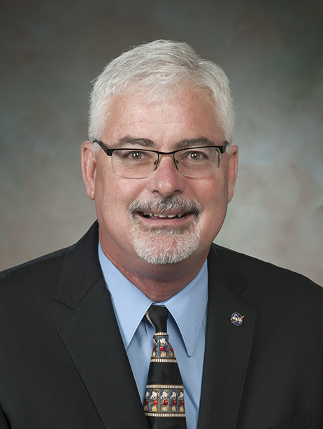 Photo of a man smiling.