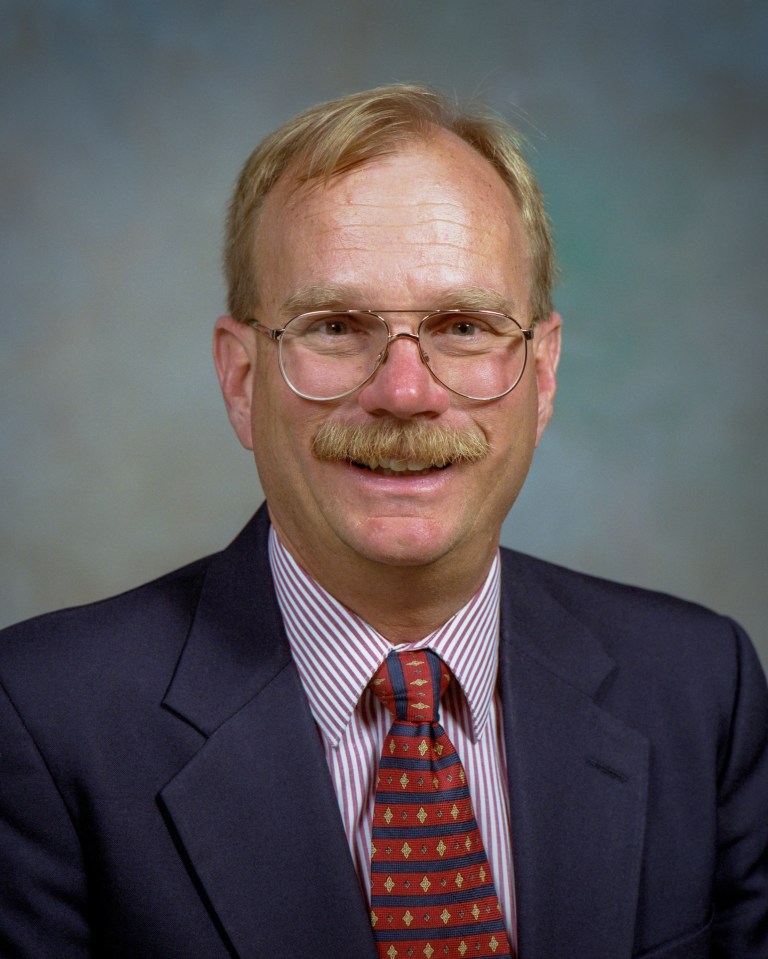 Portrait of a man smiling.
