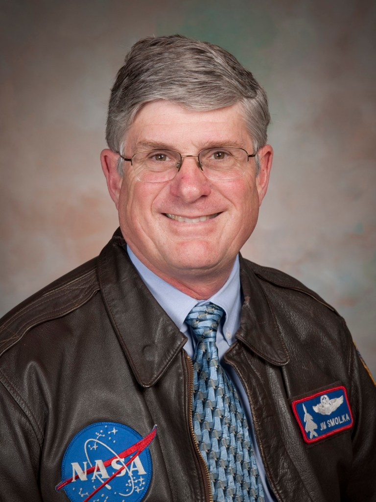 Portrait of a man smiling.